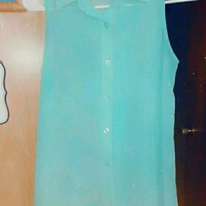 Blue button up see threw tank top.